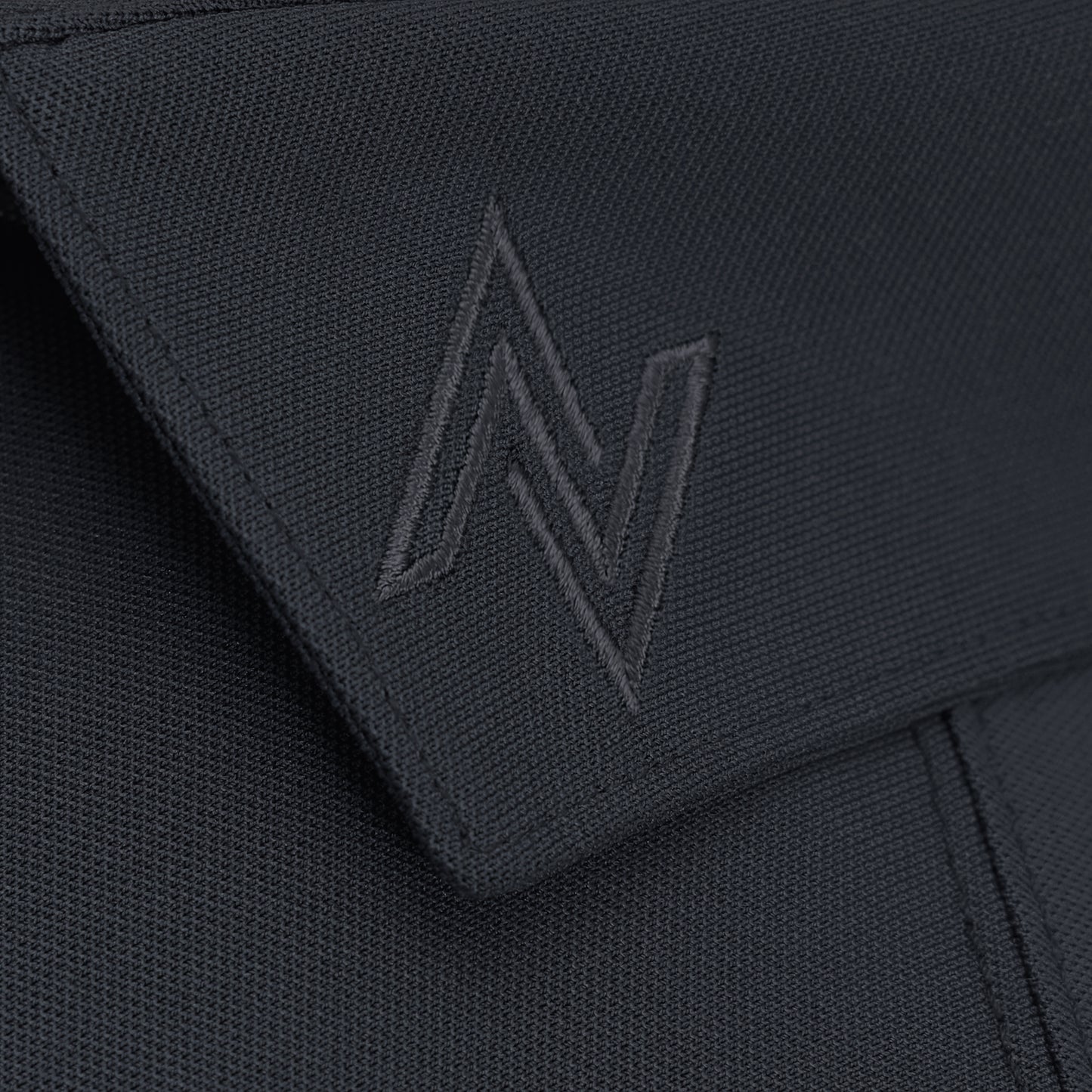 Signature Solid Polo — Caviar